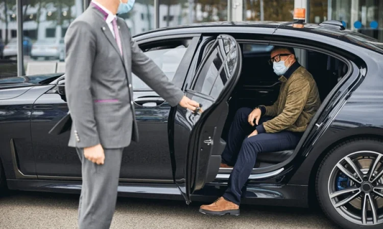 chauffeur-opening-car-door-caucasian-600nw-1843394644